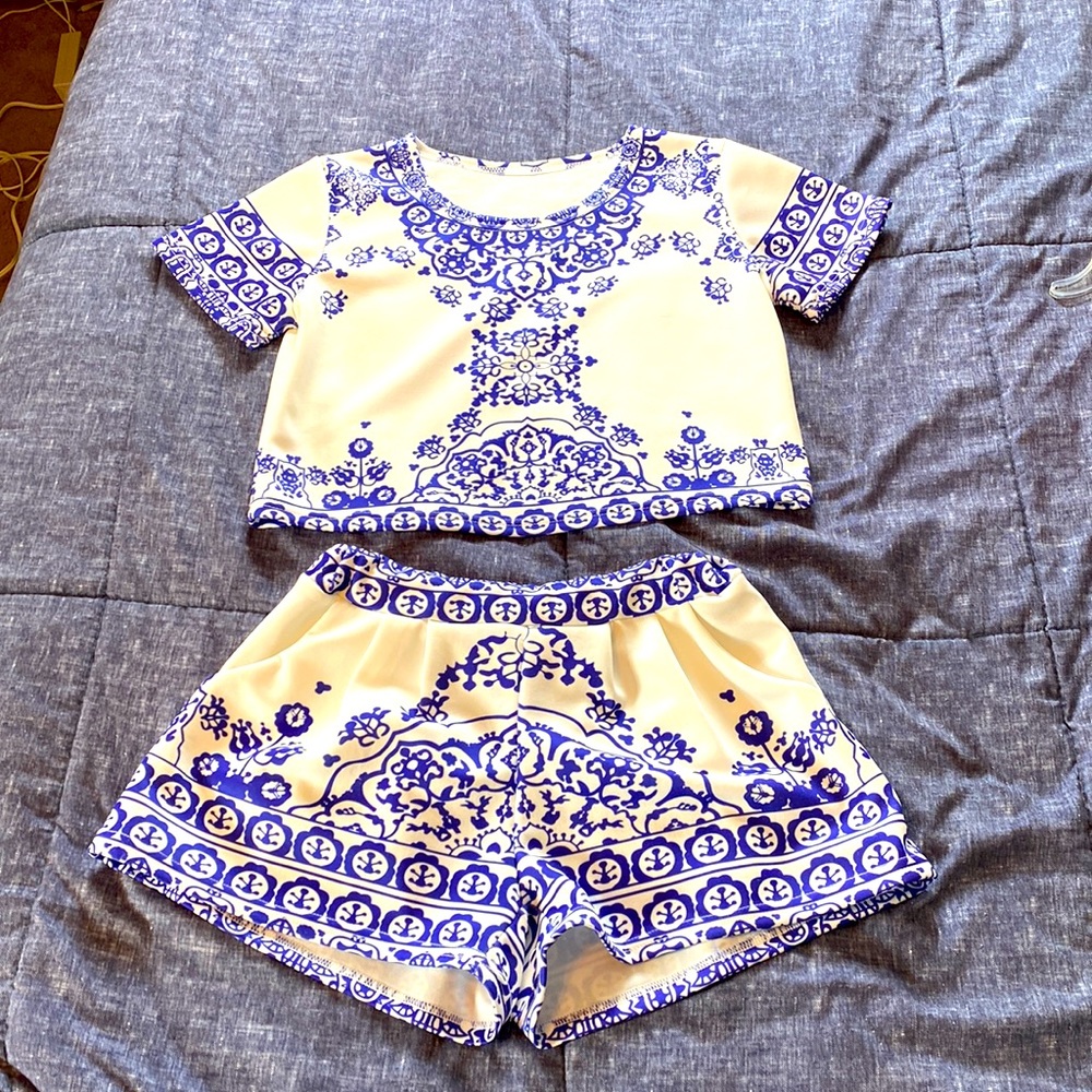 2 piece outfit. Cropped top and shorts with pockets. Thicker polyesters blend.